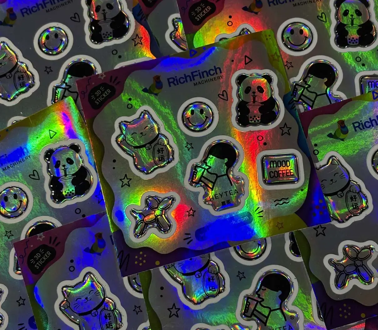 Overlapping holographic sheets of domed stickers, the domes lit from the side