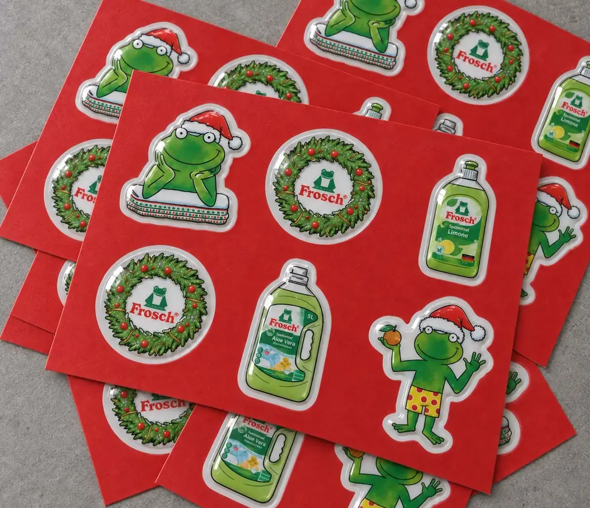 Fanned red sheets of finished domed stickers