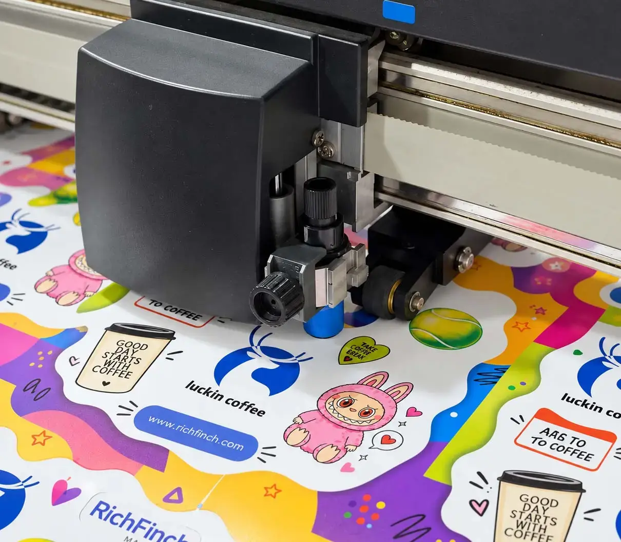 Plotter cutting contours around printed stickers, the backing left intact