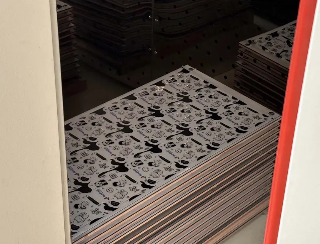 Heated curing oven loaded with curing trays of domed sheets