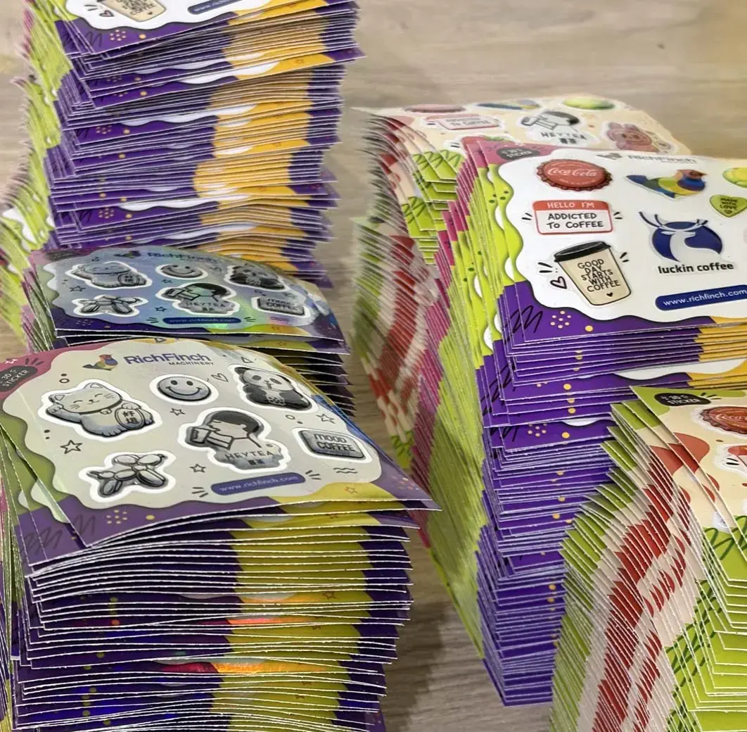 Tall stacks of packed 3D sticker packs on a table